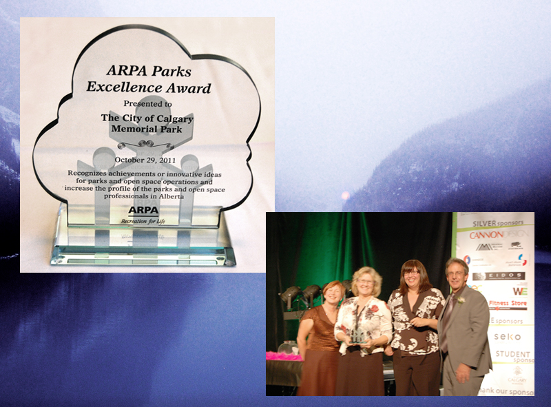 Calgary parks director Anne Charlton and CMP project manager Michelle Reid accept the ARPA parks excellence award from CFO Seve Allan.  [photo by Beltline]