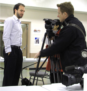 Beltlne community planner Peter Schryvers gets ready for aTV interview about planning policy in the Beltline.